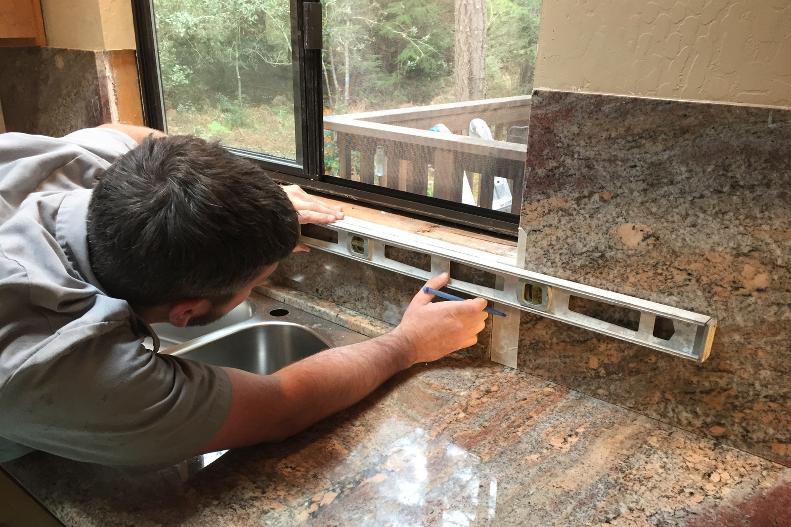 Einstein Pros Plumber fixing the kitchen remodeling